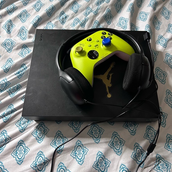 Sony Black Console with Green Controller and Black Headset